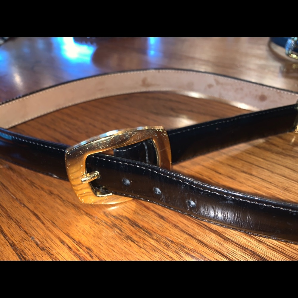 Gold chambered black belt.